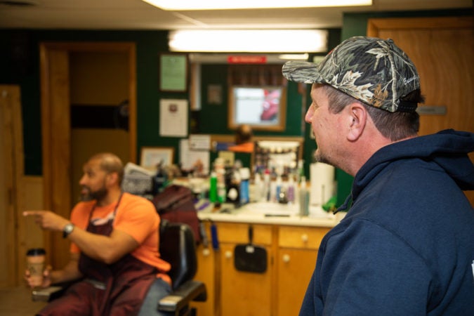 Rich Carbaugh, a Trump-supporting electrician, lingers long after his haircut at Walker's Barber Shop is over. (Jeffrey Stockbridge for Keystone Crossroads.
