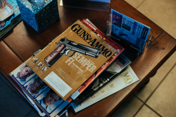 A Guns & Ammo magazine sits on the coffee table at Walker's Barber Shop, not far from a copy of The New Jim Crow. (Dani Fresh for Keystone Crossroads)