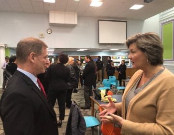 Matt Denn discusses how to influence fellow legislators with first-term Sen. Laura Sturgeon. (Cris Barrish/WHYY)