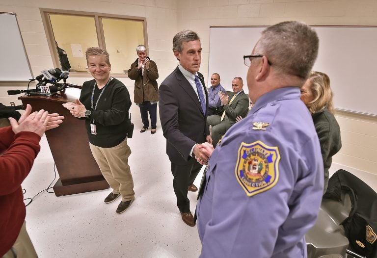 Delaware Governor John Carney shakes hands with Delaware Department of Corrections Warden Dana G. Metzger after a tour of the expanded maximum security education building at the James T. Vaughn Correctional Facility in Smyrna, Delaware on Wednesday, Feb. 5, 2020. (Butch Comegys for WHYY)