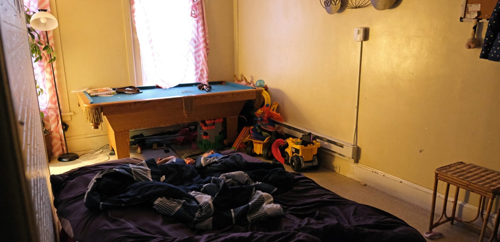 The room where Javonna Lee and her family have been sleeping in her sister's apartment. (Matt Smith for Keystone Crossroads)