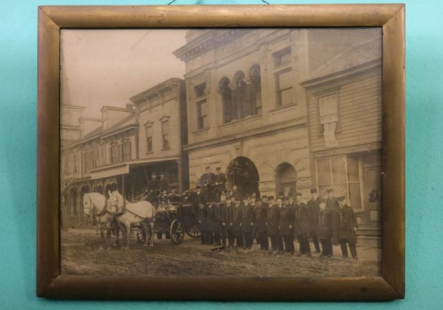 A photo of the company of firefighters taken in the 19th century is displayed at Phoenix Fire Company No. 2 in Shenandoah, Pennsylvania. (Matt Smith for Keystone Crossroads)