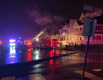 Firefighters work at the scene of a multi-alarm fire in the Ocean Grove section of Monmouth County's Neptune Township early Thursday morning. (Neptune Township OEM/Twitter)