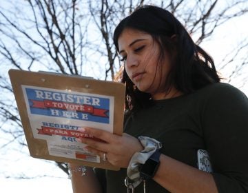 Karina Shumate, 21, a college student, filled out a voter registration form in Richardson, Texas on Jan. 18. One big registration effort this year has drawn controversy among elections officials. (LM Otero/AP)