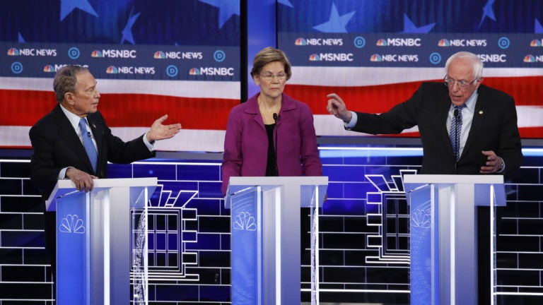 Former New York City Mayor Michael Bloomberg (left), Sen. Elizabeth Warren and Sen. Bernie Sanders participate in last week's Democratic presidential primary debate in Las Vegas. (John Locher/AP Photo)