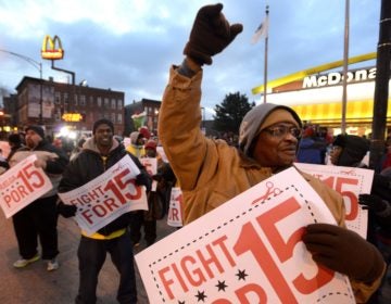 Demonstrators rally for better wages outside a McDonald's restaurant in Chicago in December 2013. (Paul Beaty/AP Photo)