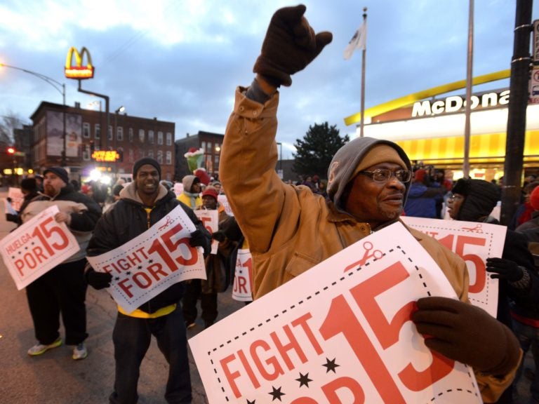 Demonstrators rally for better wages outside a McDonald's restaurant in Chicago in December 2013. (Paul Beaty/AP Photo)