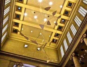 The mobile 'Ghost' by Alexander Calder hangs in the Great Stair Hall of the Philadelphia Museum of Art. (Kimberly Paynter/WHYY)