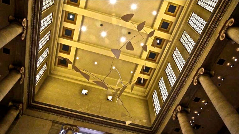 The mobile 'Ghost' by Alexander Calder hangs in the Great Stair Hall of the Philadelphia Museum of Art. (Kimberly Paynter/WHYY)
