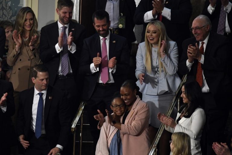 Janiyah, left, and Stephanie Davis of Philadelphia, stand as they are recognized by President Donald Trump during his State of the Union address to a joint session of Congress on Capitol Hill in Washington, Tuesday, Feb. 4, 2020. (AP Photo/Susan Walsh)