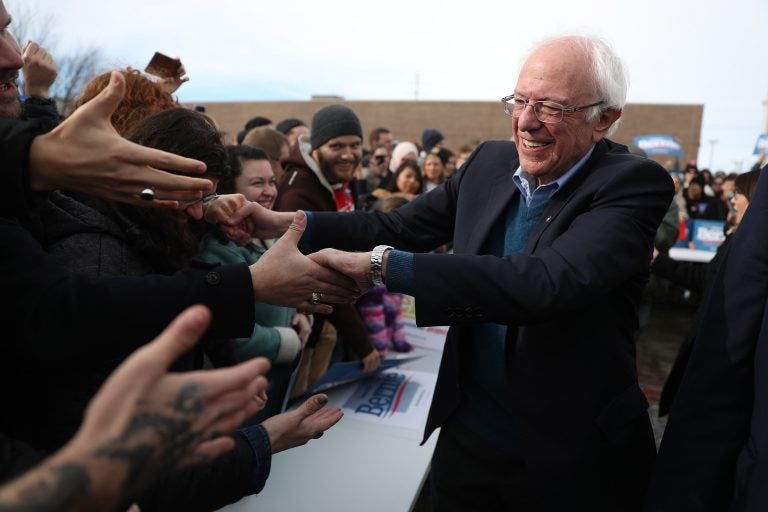 Vermont Sen. Bernie Sanders greets people at a campaign field office in Cedar Rapids, Iowa. Sanders is the slight favorite to win the caucuses, and he hopes it vaults him to the Democratic nomination. (Joe Raedle/Getty Images)