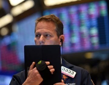 Traders work during the opening bell at the New York Stock Exchange on Thursday. Wall Street stocks opened sharply lower amid fears the coronavirus will grow into a significant international health crisis. (Johannes Eisele/AFP via Getty Images)