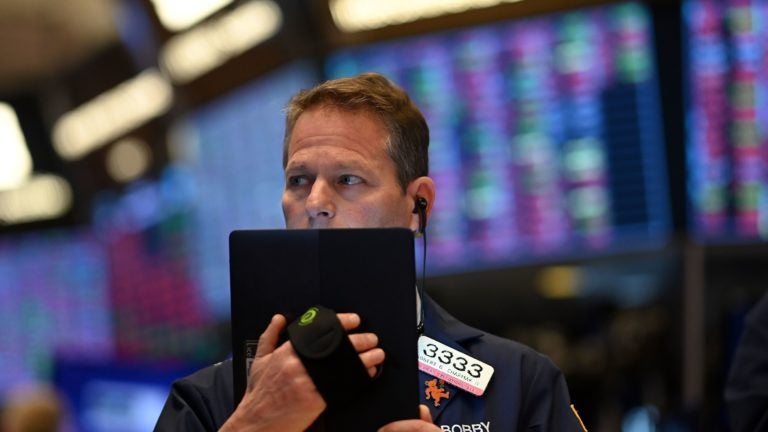 Traders work during the opening bell at the New York Stock Exchange on Thursday. Wall Street stocks opened sharply lower amid fears the coronavirus will grow into a significant international health crisis. (Johannes Eisele/AFP via Getty Images)