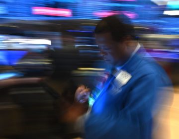 Traders work during the opening bell at the New York Stock Exchange on Friday. Losses on Wall Street deepened following a bruising open, as global markets were poised to conclude their worst week since 2008 with another rout. (Johannes Eisele/AFP via Getty Images)