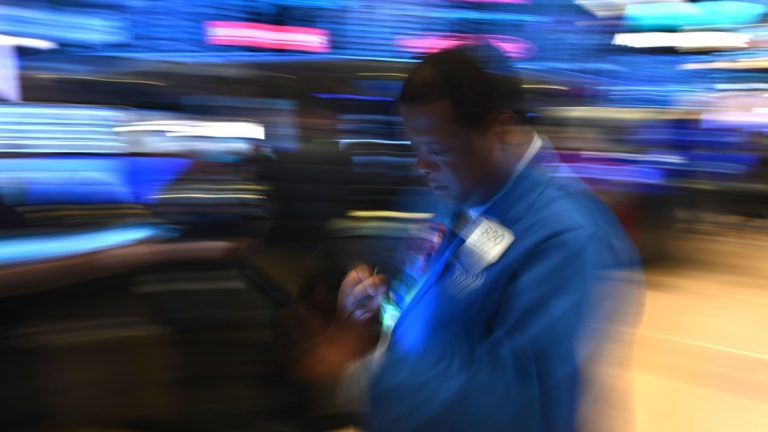 Traders work during the opening bell at the New York Stock Exchange on Friday. Losses on Wall Street deepened following a bruising open, as global markets were poised to conclude their worst week since 2008 with another rout. (Johannes Eisele/AFP via Getty Images)