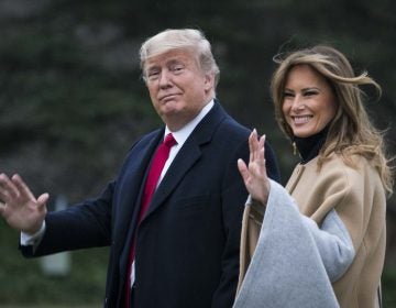 President Trump and first lady Melania Trump walk along the South Lawn as they depart from the White House for a weekend trip to Mar-a-Lago in Florida on Friday. (Sarah Silbiger/Getty Images)