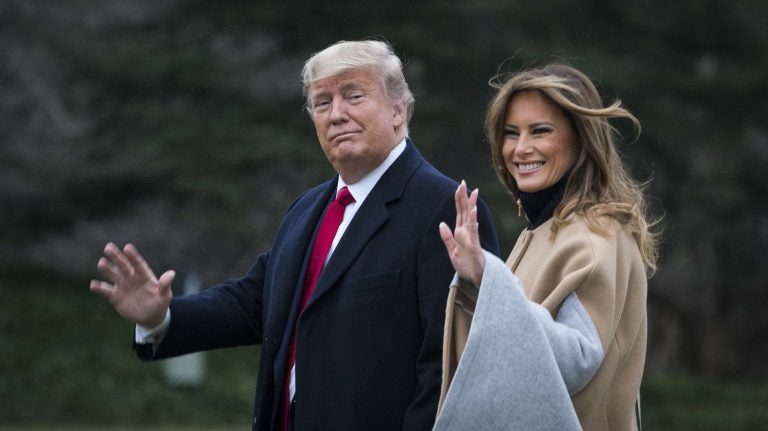 President Trump and first lady Melania Trump walk along the South Lawn as they depart from the White House for a weekend trip to Mar-a-Lago in Florida on Friday. (Sarah Silbiger/Getty Images)