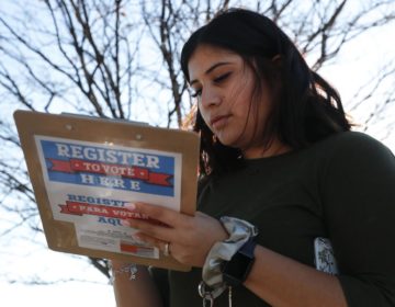 
Karina Shumate, 21, a college student, filled out a voter registration form in Richardson, Texas on Jan. 18. One big registration effort this year has drawn controversy among elections officials. (LM Otero/AP Photo)