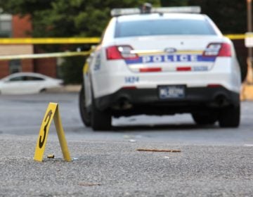 Police investigate a drive-by shooting in Germantown on Oct. 3, 2018. (Emma Lee/WHYY)