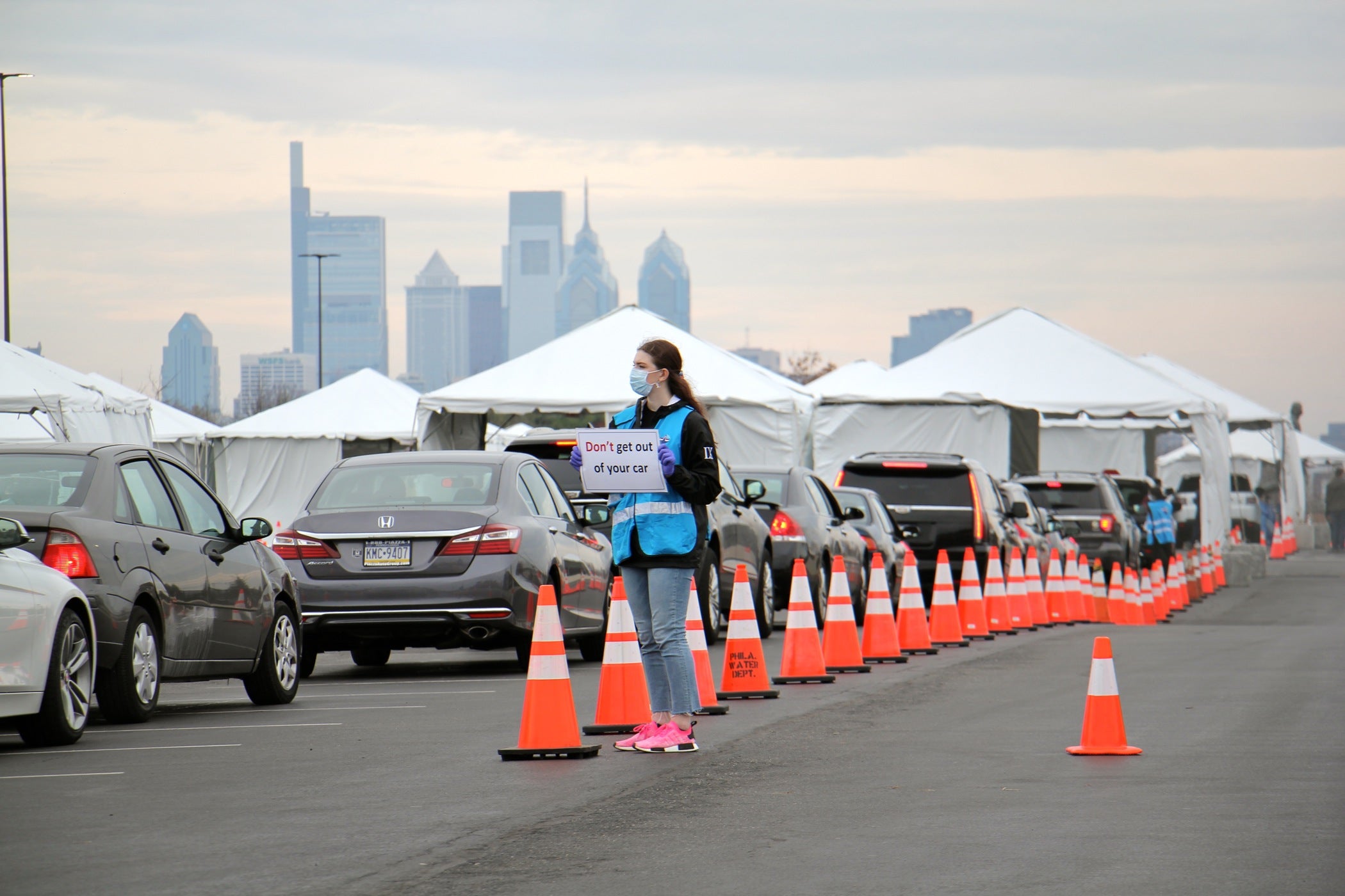 Cars line up at a drive-thru coronavirus test station in the parking lot at Citizens Bank Park.