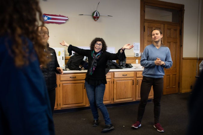 Lisa Jo Epstein (center), Artistic and Executive Director of Just Act, leads rehearsal for the play 