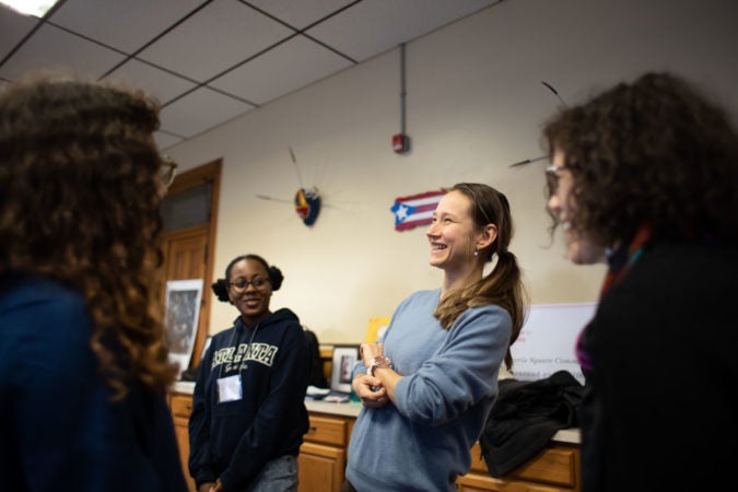 Jayla Williams (left) and Karolina Cernakova (center) participate in a warm-up exercise during rehearsal for the play 