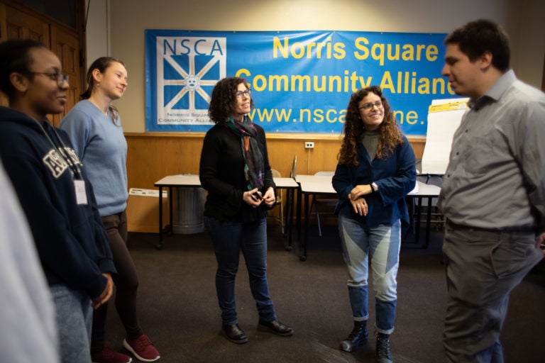 Lisa Jo Epstein (center left), Artistic and Executive Director of Just Act, leads rehearsal for the play 