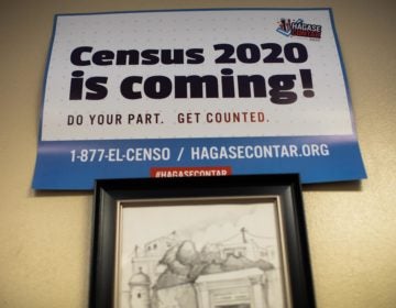 Signs posted around the offices of Ceiba in Norris Square, Kensington encourage visitors to participate in the 2020 census. (Becca Haydu for WHYY)