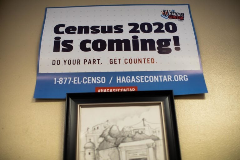 Signs posted around the offices of Ceiba in Norris Square, Kensington encourage visitors to participate in the 2020 census. (Becca Haydu for WHYY)