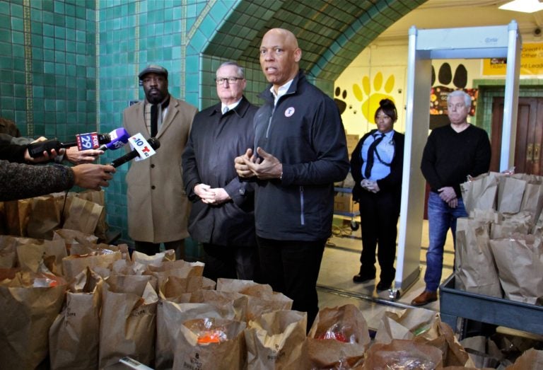 Philadelphia schools Superintendant William Hite (center) is joined by (from left) Councilmember Kenyatta Johnson and Mayor Jim Kenney during a press conference at Tilden Middle School, where hundreds of bagged meals were prepared for students on March 16, 2020. (Emma Lee/WHYY)