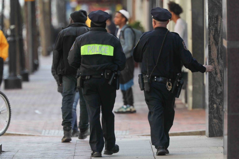 Police officers patrol Market Street in Wilmington, Del., on Thursday, March 26. (Saquan Stimpson for WHYY)