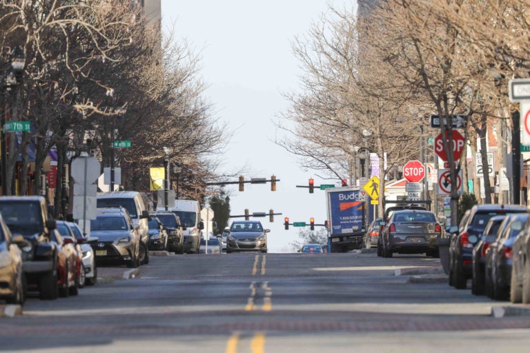 A street with cars in Wilmington, Del. is visible.