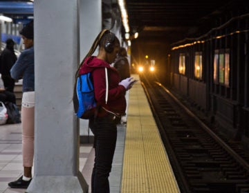 A rider waits for a SEPTA train.