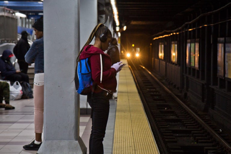 A rider waits for a SEPTA train.