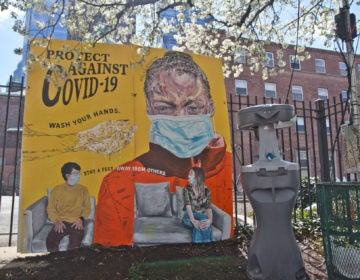 A mural created by artist Nile Livingston was installed at 17th and Vine streets along with a public hand washing station meant for people who are living with housing instability. (Kimberly Paynter/WHYY)