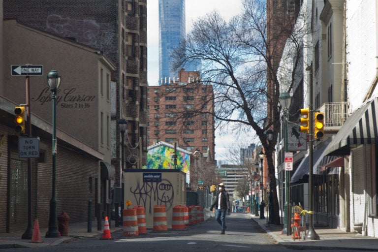 A person walks down Sansom Street in Center City Tuesday. (Kimberly Paynter/WHYY)