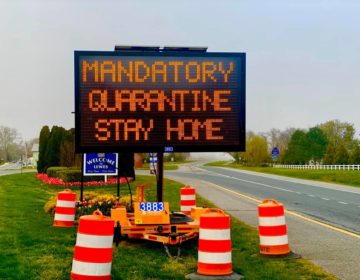 Road sign alerts drivers of mandatory quarantine. (Photo courtesy of Joy Marie)