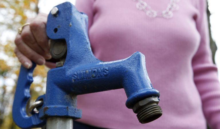 a close-up of a tap for well water