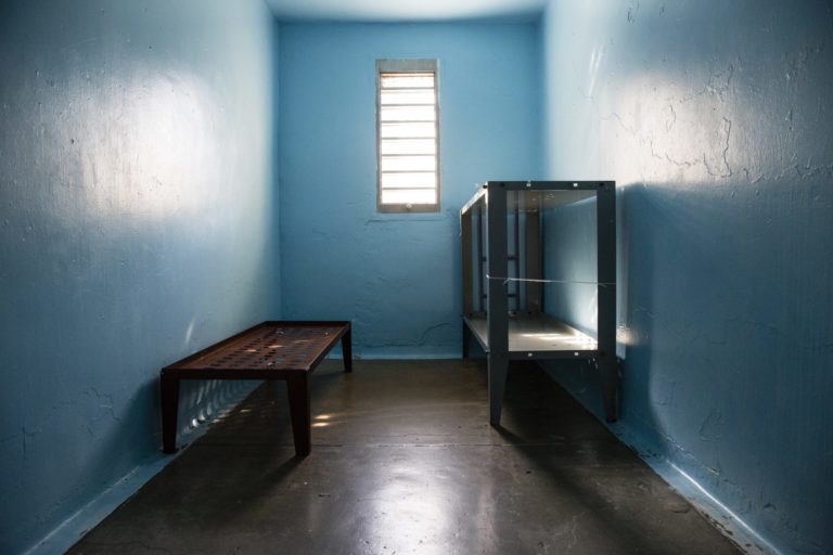 inside jail cell looking out