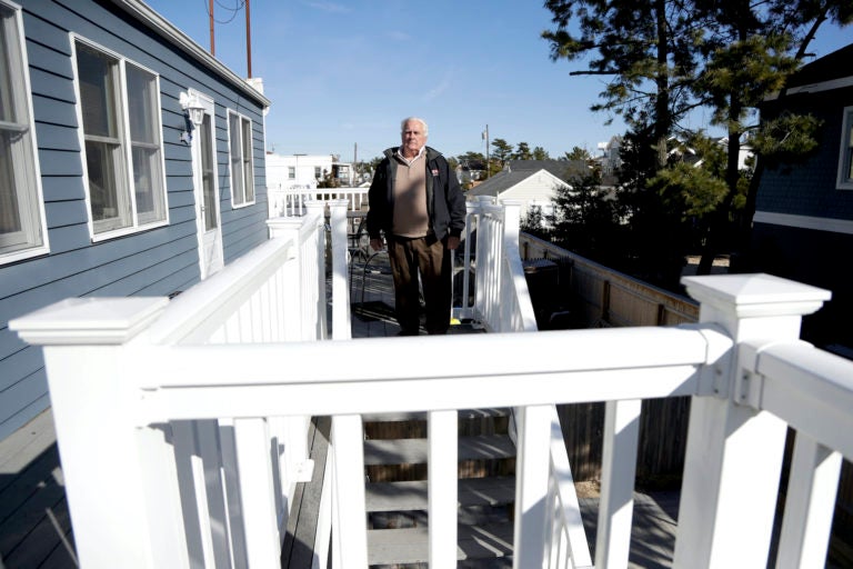 In a photo taken Friday, Jan. 11, 2019, Vince Farias poses for The Associated Press outside one of his vacation rental properties in Surf City, N.J. (Julio Cortez/AP Photo)