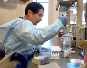 Microbiologist Xiugen Zhang runs a Polymerase Chain Reaction (PCR) test at the Connecticut State Public Health Laboratory, Monday, March 2, 2020, in Rocky Hill, Conn. (Jessica Hill/AP Photo)