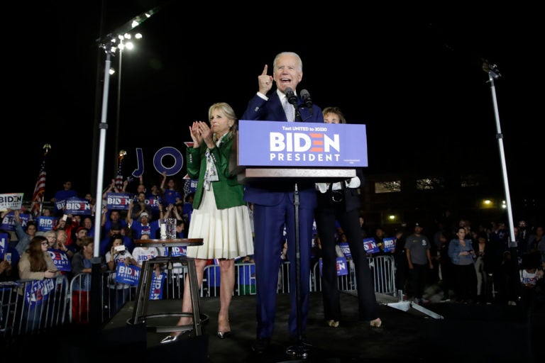 Democratic presidential candidate former Vice President Joe Biden speaks, next to his wife Jill during a primary election night rally Tuesday, March 3, 2020, in Los Angeles. (AP Photo/Marcio Jose Sanchez)