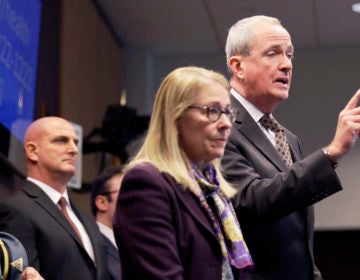 FILE- In this March 2, 2020 file photo, New Jersey Gov. Phil Murphy, right, is joined by Health Commissioner Judith Persichilli, center, during a news conference in Ewing, N.J., Monday, March 2, 2020. On Wednesday, March 4, 2020, Murphy, Persichilli and Acting Governor Sheila Oliver announced the first presumptive positive case of novel coronavirus, or COVID-19, in New Jersey. The individual, a male in his 30s, is hospitalized in Bergen County and has been hospitalized since March 3. (AP Photo/Seth Wenig, File)