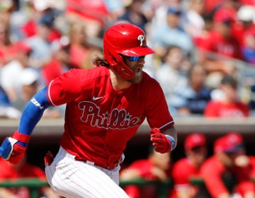 Philadelphia Phillies' Bryce Harper runs to first during a spring training baseball game against the New York Yankees, Monday, March 9, 2020, in Clearwater, Fla. (AP Photo/Carlos Osorio)