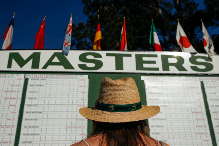 Anna Lee Lavarnway looks at the leaderboard during the first round at the Masters golf tournament Thursday, April 5, 2018, in Augusta, Ga. (Charlie Riedel/AP Photo)