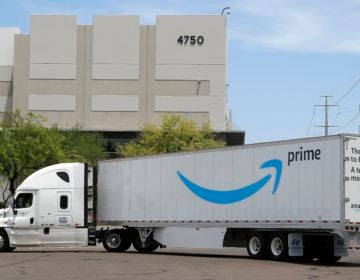 This July 17, 2019, file photo shows an Amazon shipping truck at a fulfillment center in Phoenix. (Ross D. Franklin/AP Photo)