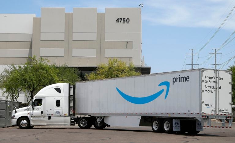 This July 17, 2019, file photo shows an Amazon shipping truck at a fulfillment center in Phoenix. (Ross D. Franklin/AP Photo)