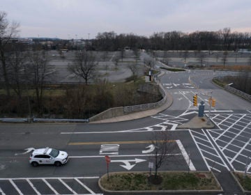A security car cruises the almost completely empty parking lots of Garden State Plaza in Paramus, N.J., Wednesday, March 18, 2020. (Seth Wenig/AP Photo)