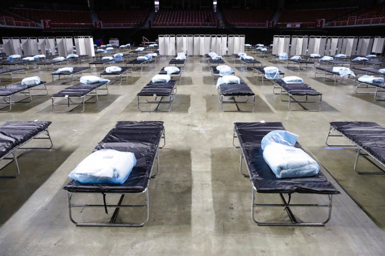 A federal medical station is set up at Temple University's Liacouras Center in Philadelphia, Monday, March 30, 2020, to accommodate an influx in hospital patients due to the coronavirus outbreak. (AP Photo/Matt Rourke)