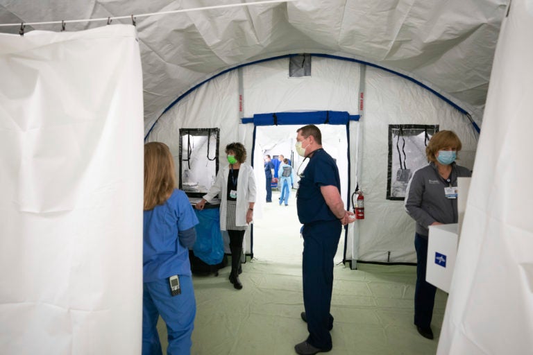 Virus Outbreak Pennsylvania Medical staff inside the new emergency response tent during a media tour of the facility at Doylestown Hospital, in Doylestown, Pa., Monday, March 30, 2020. (Jessica Griffin/The Philadelphia Inquirer via AP)